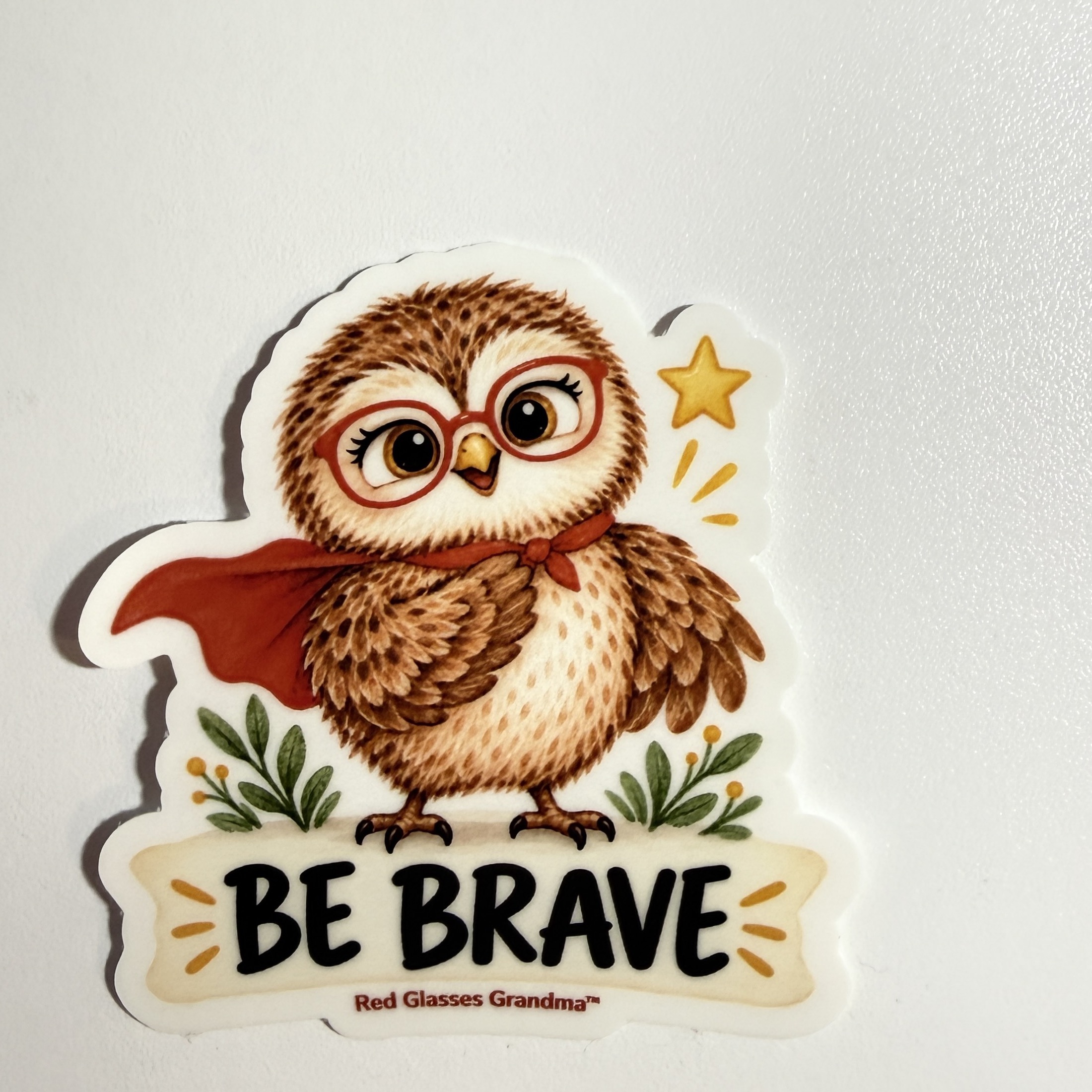 Be Brave owl sticker, with a caped owl wearing red glasses